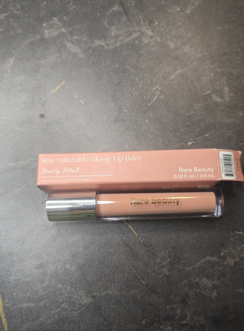 Rare Beauty Stay Vulnerable Glossy Lip Balm in Nearly Petal - Peachy Nude Pink